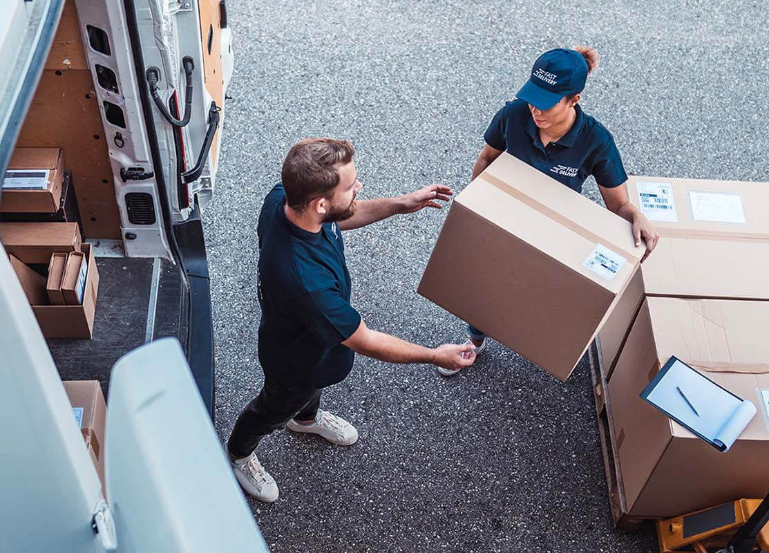 People loading a hired shipping container